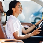 Woman drives vehicle.